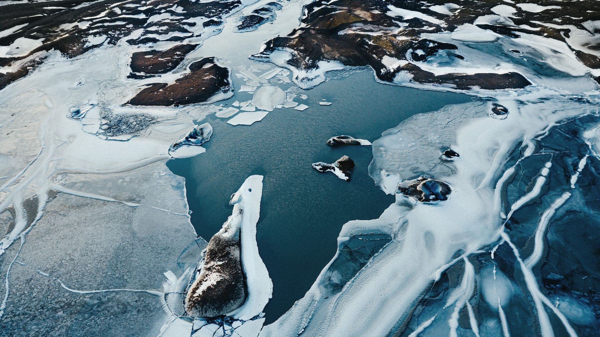 aerial view of a partially frozen lake
