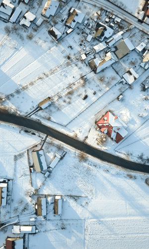 drone view of a village in the snow