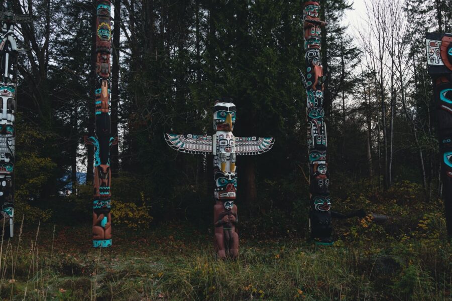 totem poles in a forest